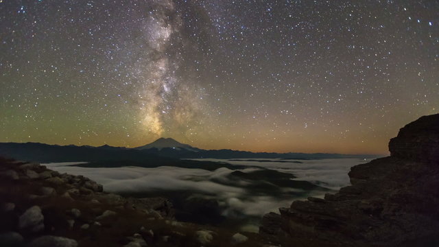 Moonset and starry sky rotation in mountains