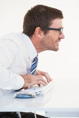 Business worker with reading glasses on computer