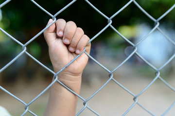 child's hand in jail.