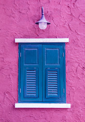 Blue window on pink wall background