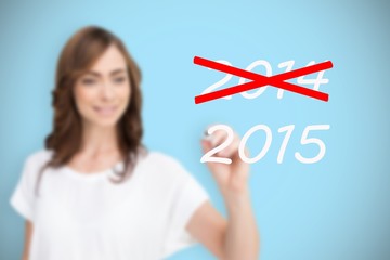 Composite image of smiling businesswoman holding marker