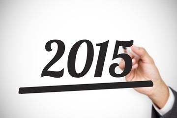 Composite image of hand holding a marker