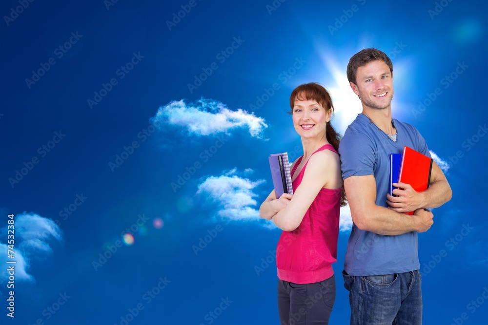 Aufkleber Composite image of two students both with notepads