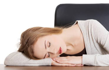 Obraz na płótnie Canvas Tired woman slepping on desk