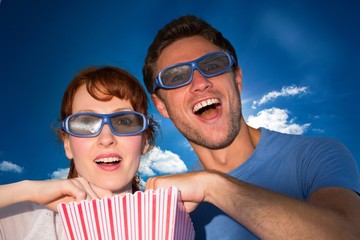 Obraz premium Composite image of couple enjoying a movie night