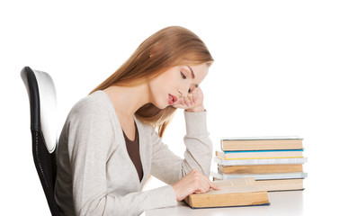 Tired woman preparing to exam