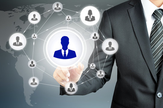 Hand pointing to businessman icon in the middle that linked with
