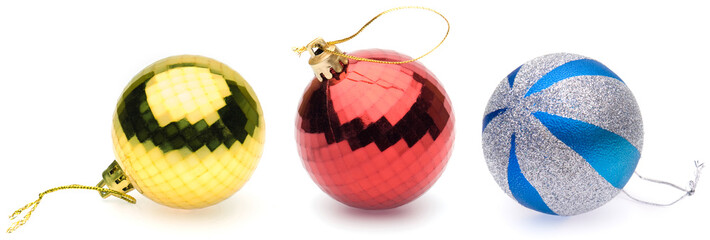 yellow, red, blue-silver christmas balls on white background
