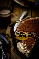 cheesecake with prunes and chocolate cut on pieces