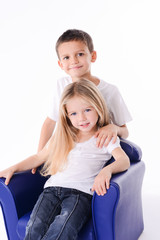 isolated studio portrait two young children brother and sister