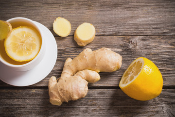 Ginger tea with lemon in a white cup
