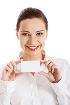 Portrait of woman with business card