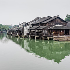 Chinese wood houses besides the river