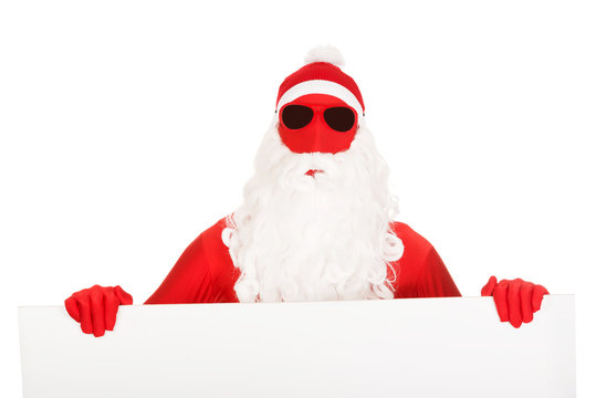Portrait of santa man holding empty banner