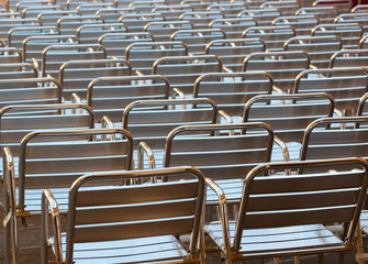 Empty metal seats places in public space