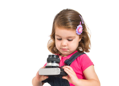 Kid photographing over white background