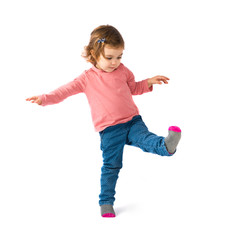 Little girl walking over white background