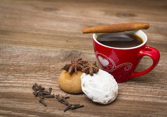 Coffee and gingerbread cake desert on wooden table