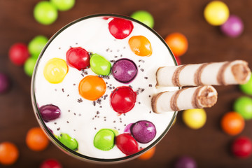 Delicious dessert with colorful candies