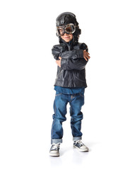 Kid dressed as aviator with his arms crossed