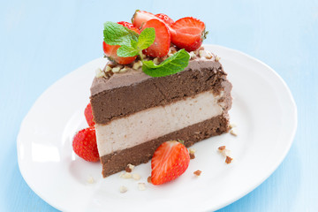 piece of chocolate cake of three layers on plate