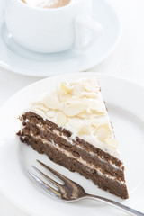 piece of chocolate cake with cream, vertical