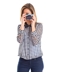 Woman photographing over white background