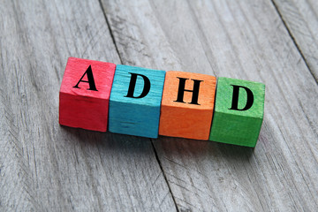 concept of ADHD on colorful wooden cubes - obrazy, fototapety, plakaty