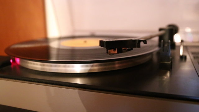 Video with running old gramophone turntable with disc.