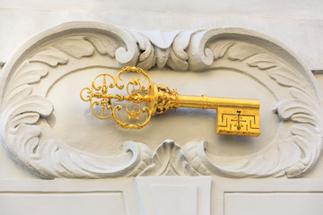 Fototapeta premium Gold key, house motif. Prague, Czech Republic