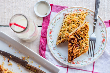 pie pastry with apple jam and milk in a glass bottle