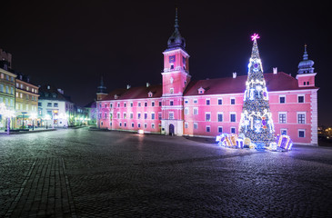 Christmas decorations on the old town of Warsaw at night.Royal C