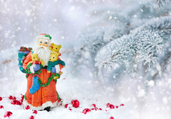 Santa Claus on a background snow-covered fir branches