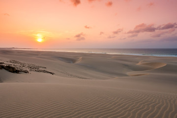 Obraz na płótnie Canvas Sunset on sand dunes in Chaves beach Praia de Chaves in Boavist