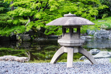 Fototapeta na wymiar japanese traditional stone lantern in a park in tokyo