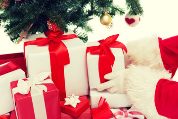 close up of santa claus with presents