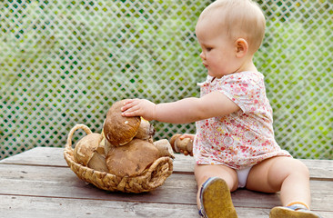One-year-old girl  with mushrooms porcini