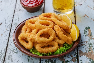Fototapete fried squid rings, breaded with lemon © koss13
