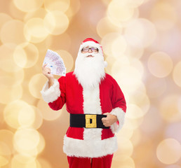 man in costume of santa claus with euro money