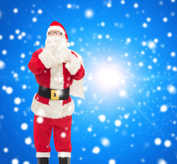 man in costume of santa claus with bag