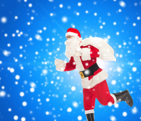man in costume of santa claus with bag