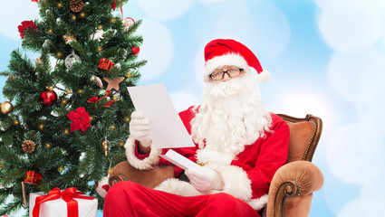 man in costume of santa claus with letter