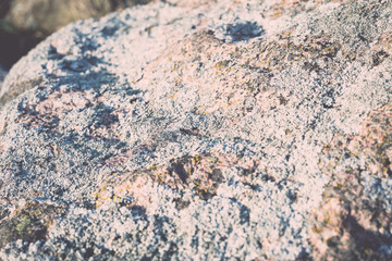 rocky beach at sunset with milky water - retro, vintage