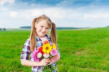 Outdoor summer portrait of adorable little girl