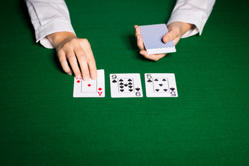 holdem dealer with playing cards