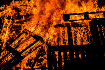 Burning wood pallets in flames