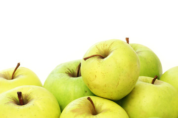 A lot of green apples on a white background
