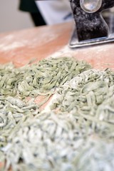 Fresh green pasta on table. Fettuccini homemade.