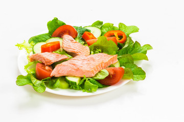 Salad with smoked salmon on white background