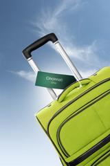 Cincinnati, Ohio. Green suitcase with label
